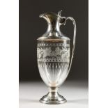 A CONTINENTAL SILVER MOUNTED CUT GLASS CLARET JUG. 11ins high.