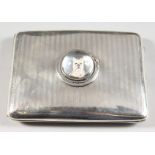 AN ENGINE TURNED SILVER CIGARETTE CASE, inset with an Essex crystal of a dog. Chester 1919.