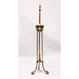 A CLASSICAL ADAM REVIVAL BRASS FLOOR STANDING LAMP, with reeded upper column, ram's head and leaf