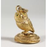 A GILDED OWL SEAL.