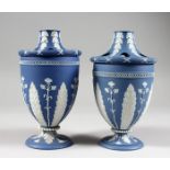 TWO 18TH / 19TH CENTURY PALE BLUE JASPERWARE URN SHAPED BOUGH POTS AND COVERS, each with pierced