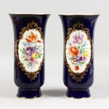 A GOOD LARGE PAIR OF 19TH CENTURY MEISSEN BEAKER VASES with rich blue ground painted with a large