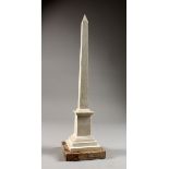 A CARVED STONE OBELISK. 16ins high.