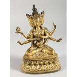 A THAI GILT BRONZE MULTI-ARM SEATED DEITY. 7ins high.