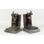 TWO AMUSING BRONZE AND MARBLE DACHSHUND BOOKENDS. Each 12ins long.
