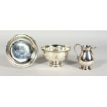 A GEORGE II SILVER THREE PIECE COMMUNION SET, bowl, paten and jug. London 1729. Maker William