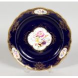 A GOOD MEISSEN PORCELAIN PLATE, rich blue ground edged in gilt, with bouquet of flowers and three