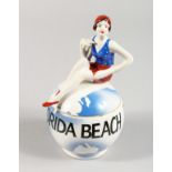 A MATCHING ART DECO STYLE POT AND COVER, the lid with a female swimmer. 3ins high.