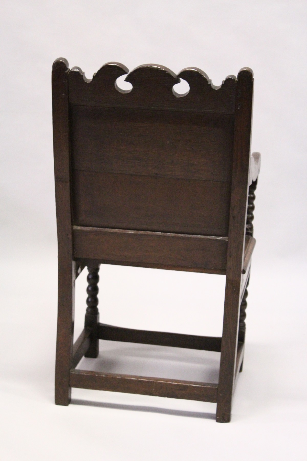 A 17TH CENTURY OAK WAINSCOTT CHAIR, with shaped cresting rail, carved back panel, the solid seat - Image 4 of 4