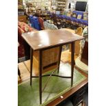 An Edwardian inlaid mahogany occasional table.