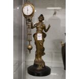 An Art Nouveau style figural mystery clock.