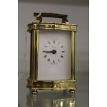 An Asprey's small brass carriage clock.