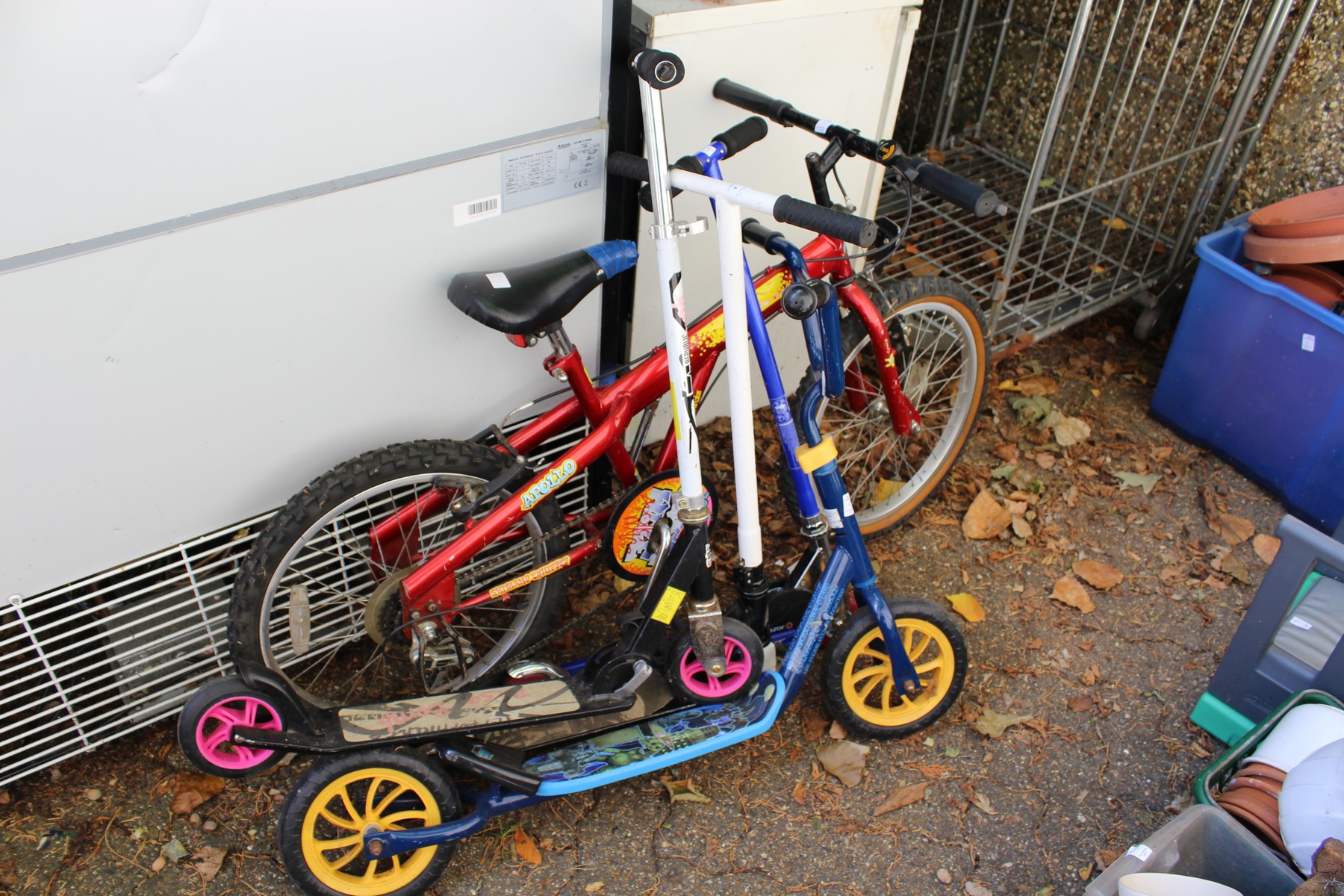 A child's bike and four scooters.