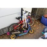 A child's bike and four scooters.