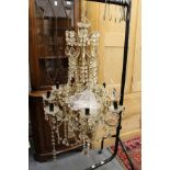 A cut glass eight branch chandelier.