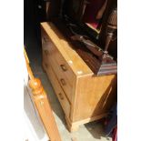 A limed oak three drawer dressing chest.