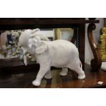 A porcelain model of an elephant.