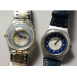 Two Swatch watches.