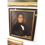 A bust length portrait of a gentleman in a dark jacket holding a scroll, oil on board.