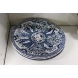 Four blue and white Chinese plates.