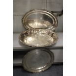 A large plated oval tray with similar dish and circular tray.