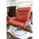 A red leather swivel armchair.
