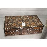 An eastern inlaid wooden box.