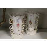 A pair of floral decorated vases.