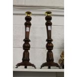 A good pair of turned wood candlesticks.