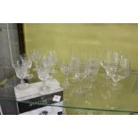 Various cut glass and etched drinking glasses.