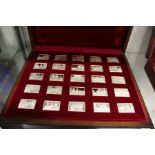 A cased set of twenty five cast silver ingots commemorating Queen Elizabeth II.