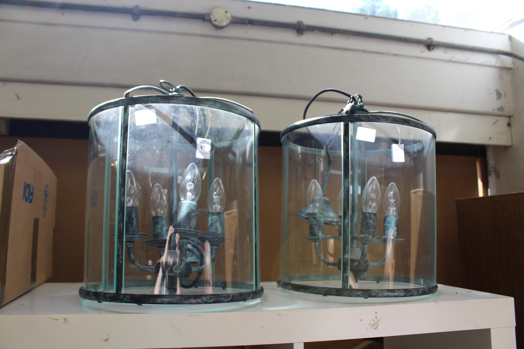 A good pair of hall lanterns, circular design with a verdigris patinated finish.