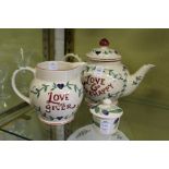 An Emma Bridgewater teapot and matching jug and similar item.