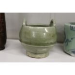 A Chinese sang style celadon porcelain candlestick holder.