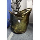 A brass coal scuttle.