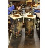 A pair of decorative pottery stands.