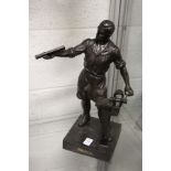 A continental spelter model of a workman stood beside a vice.