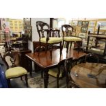 A set of eight Victorian style mahogany dining chairs one with arms.