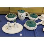 A small group of Denby Green Wheat china.