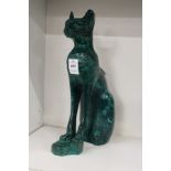 A carved malachite model of a cat.