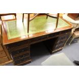 A reproduction mahogany pedestal desks.