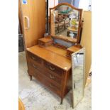 An Edwardian mahogany dressing chest.