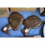 Two carved hardwood portrait plaques.