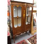 An Edwardian inlaid mahogany two door display cabinet.