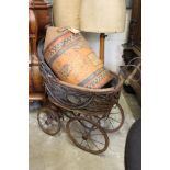 A Victorian style doll's pram.