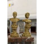 A pair of small gilt metal busts on marble bases.