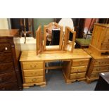 A pine pedestal dressing table and mirror.