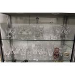 A large quantity of cut glass drinking glasses, decanters, bowls etc.