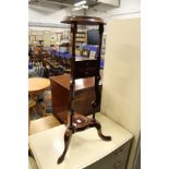 A reproduction mahogany wash stand.