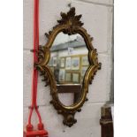 A small gilt framed mirror.